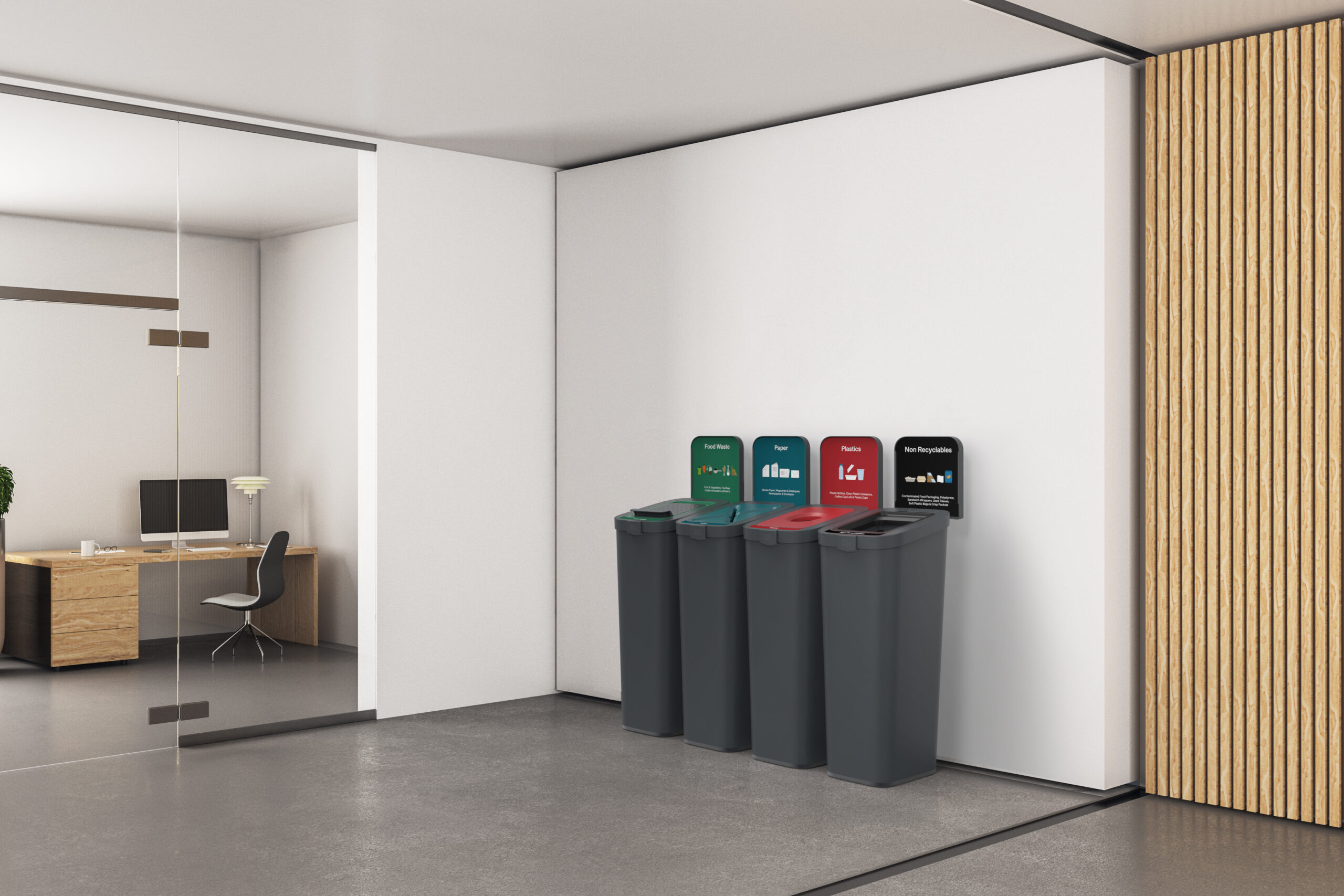 Organized waste and recycling collection bins in a modern office